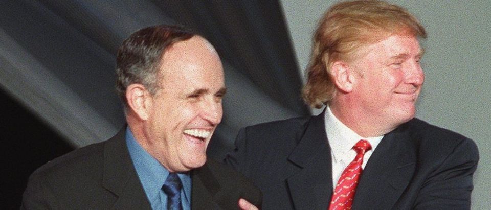 New York City Mayor Rudy Giuliani (L) with Donald Trump (R) during the NYC2000 fashion show in New York City. (MATT CAMPBELL/AFP/Getty Images)