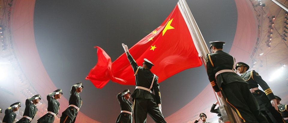 China's national flag is raised during the opening ceremony of the Beijing 2008 Olympic Games at the National Stadium in this August 8, 2008 file photo. REUTERS/Jerry Lampen/Files