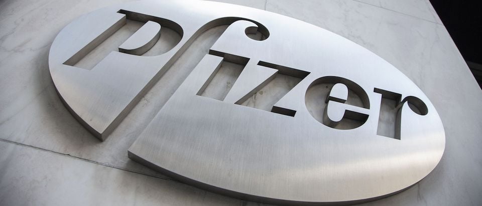 The Pfizer logo is seen at their world headquarters in New York April 28, 2014. U.S. drugmaker Pfizer Inc approached Britain's AstraZeneca Plc two days ago to reignite a potential $100 billion takeover and was rebuffed, raising investor expectations it will have to increase its offer to close the deal. REUTERS/Andrew Kelly