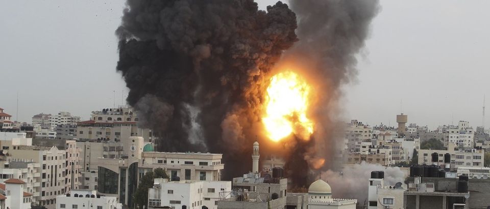 An explosion and smoke are seen after Israeli strikes in Gaza City