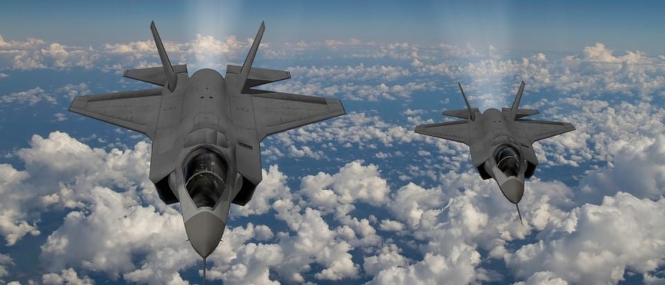 Two F-35s fly side-by-side. Source: Keith Tarrier/Shutterstock