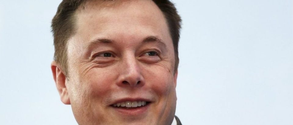 Tesla Chief Executive Elon Musk smiles as he attends a forum on startups in Hong Kong