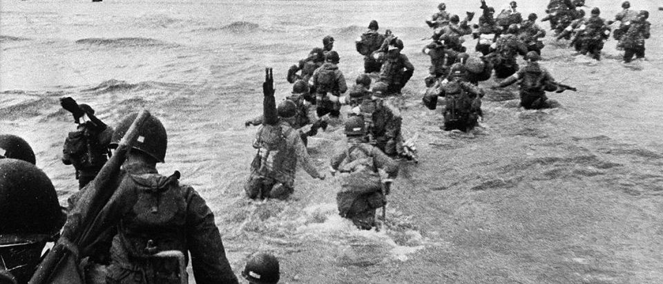UTAH BEACH, FRANCE: US troops disembark from landing crafts during D-Day 06 June 1944 after Allied forces stormed the Normandy beaches. D-Day, 06 June 1944 is still one of the world's most gut-wrenching and consequential battles, as the Allied landing in Normandy led to the liberation of France which marked the turning point in the Western theater of World War II. AFP PHOTO (Photo credit should read -/AFP/Getty Images)