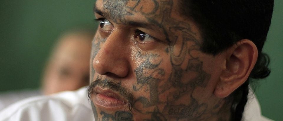 Walter Geovani Salguero, 30, an inmate and member of El Salvador's Mara Salvatrucha (MS-13) gang, participates in a pledge event during a news conference at the Sonsonate jail