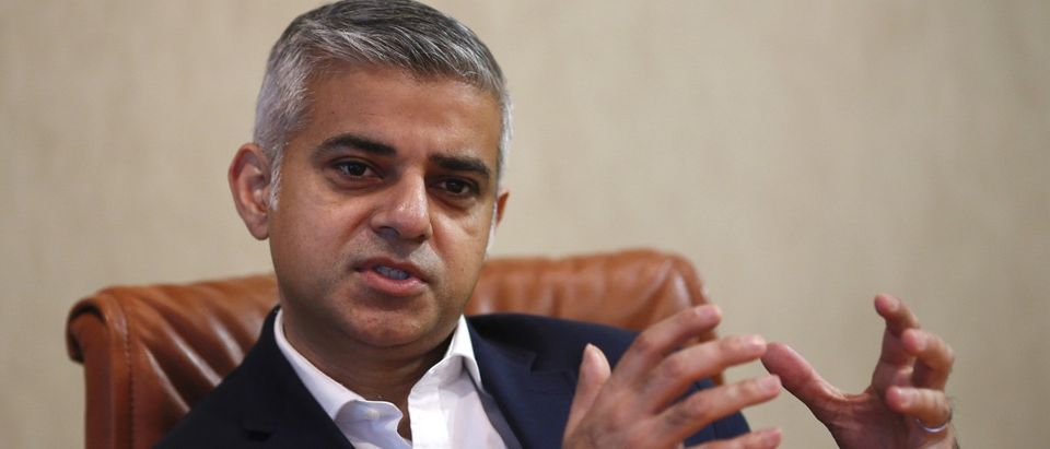 London mayoral candidate Khan gestures during an interview with Reuters at Canary Wharf in London