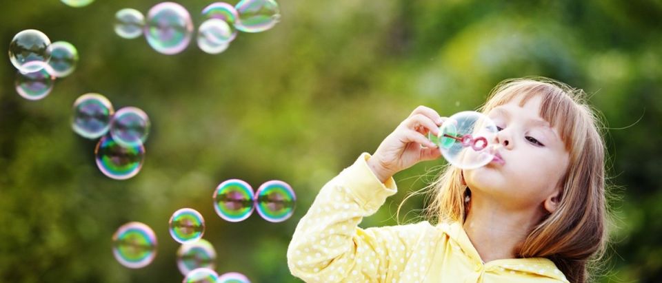 Child blowing bubbles (Credit: Alena Ozerova/Shutterstock)