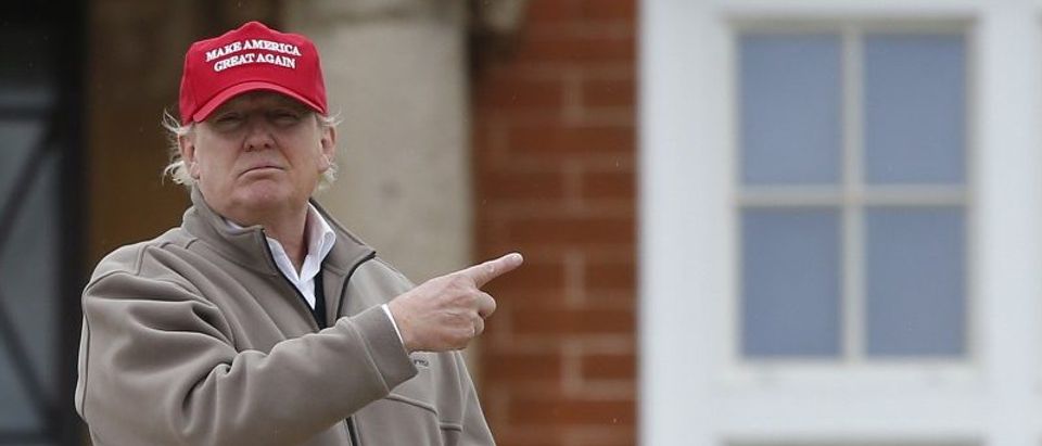 File photo of U.S. Republican presidential candidate and businessman Donald Trump gesturing outside his hotel at the Trump Turnberry Resort in Scotland