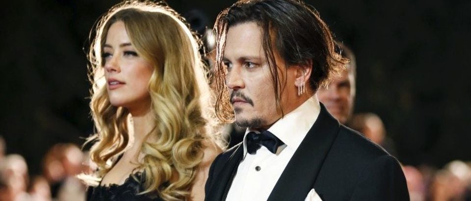 Desert Palm Achievement Award recipient actor Johnny Depp and wife actress Amber Heard pose at the 27th Annual Palm Springs International Film Festival Awards Gala in Palm Springs, California