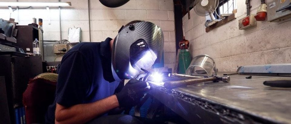 Welder Sean Johnson welds at Contracts Engineering Ltd, a steel products manufacturer, in Sittingbourne, southeast England