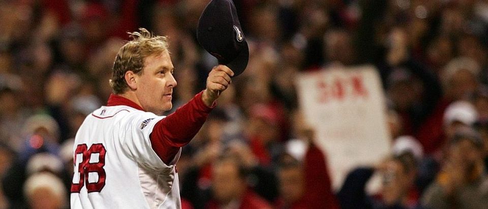 Curt Schilling of the Boston Red Sox tips his hat to the crowd as he comes out of the game in the sixth inning against the Colorado Rockies during Game Two of the 2007 Major League Baseball World Series at Fenway Park on October 25, 2007 in Boston