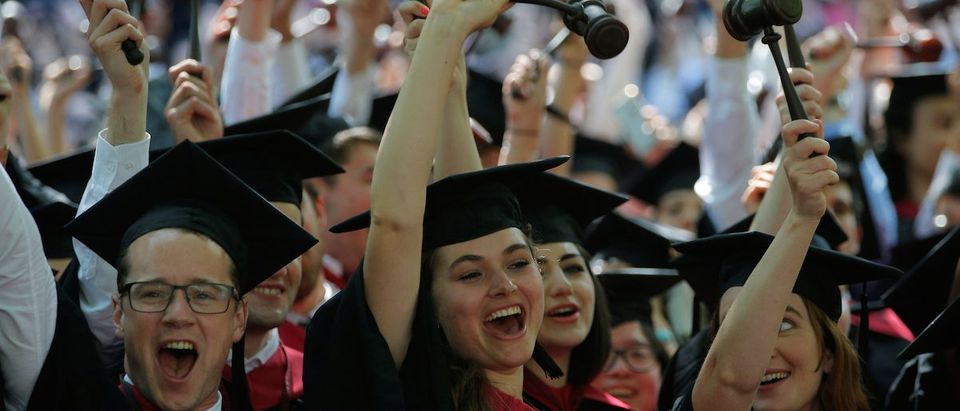 Graduating Law School students cheer as they receive their degrees during the 365th Commencement Exercises at Harvard University in Cambridge, Massachusetts, May 26, 2016. REUTERS/Brian Snyder