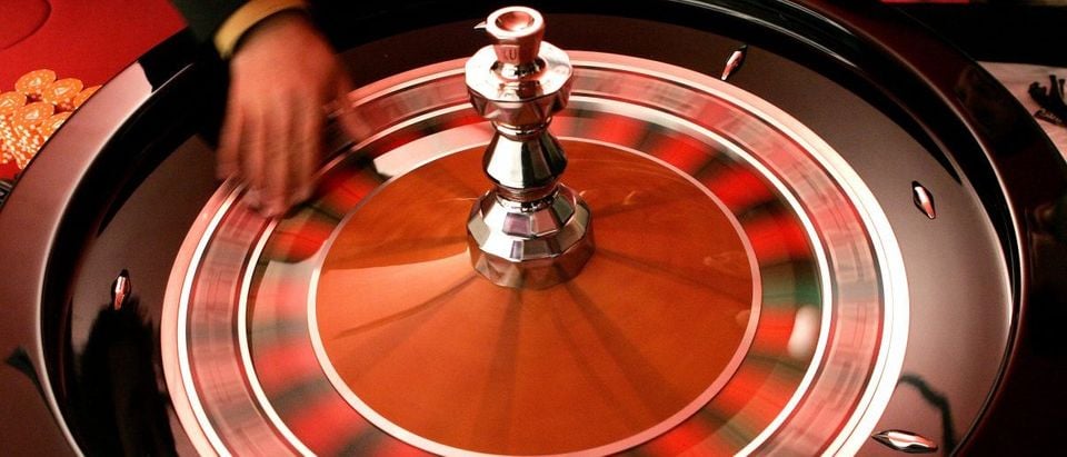 Croupier turns the roulette at the Brussels Casino