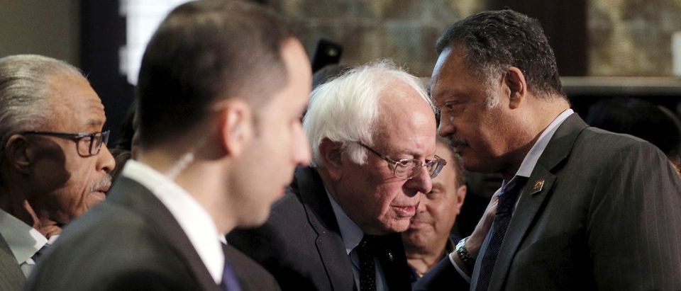 U.S. Democratic presidential candidate and U.S. Senator Bernie Sanders and the Reverend Jesse Jackson talk at the National Action Network national convention in New York April 14, 2016. REUTERS/Brian Snyder