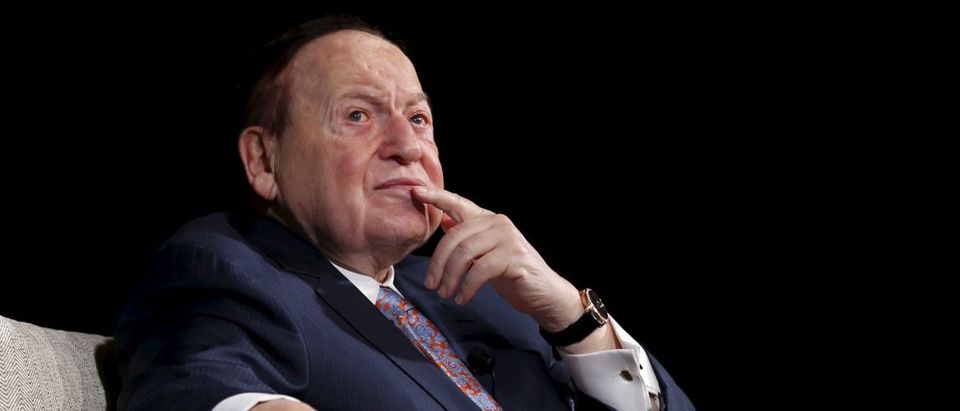 Gambling giant Las Vegas Sands Corp's Chief Executive Sheldon Adelson reacts during a news conference in Macau, China