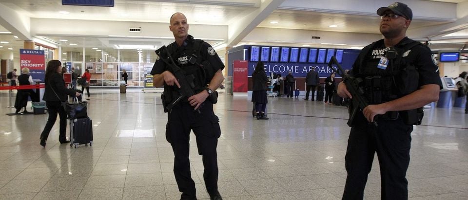 Atlanta police officers Herrick (L) and Reid (R) patrol at the check-in area as they carry sub-machine guns at Hartsfield-Jackson International Airport in Atlanta, November 17, 2015. REUTERS/Tami Chappell
