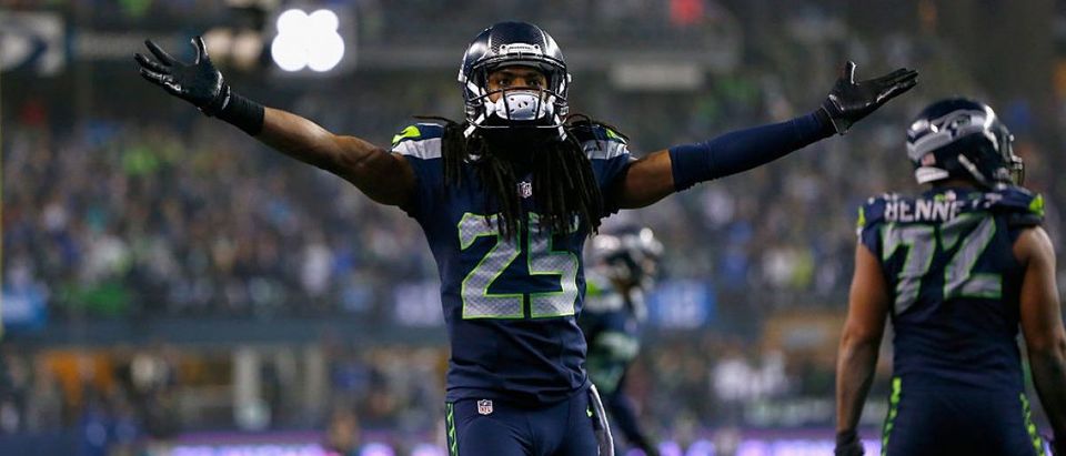 Richard Sherman #25 of the Seattle Seahawks reacts after a play against the Carolina Panthers during the 2015 NFC Divisional Playoff game at CenturyLink Field on January 10, 2015 in Seattle, Washington