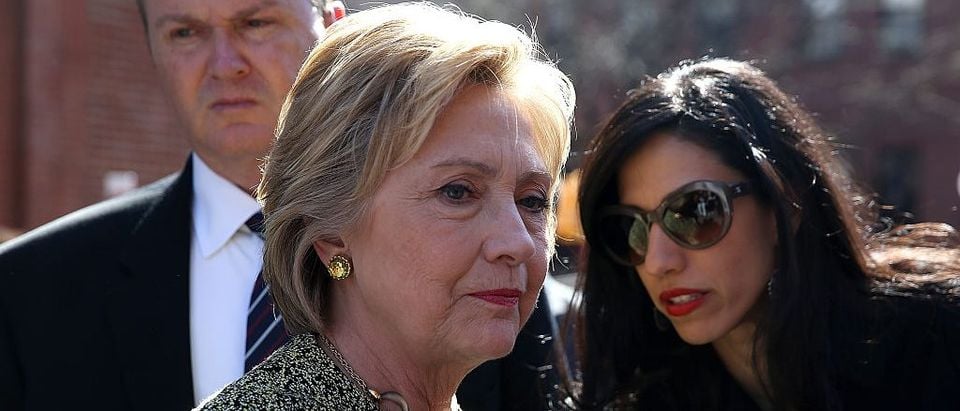 Hillary Clinton talks with aide Huma Abedin before speaking at a neighborhood block party on April 17, 2016 in Brooklyn (Getty Images)
