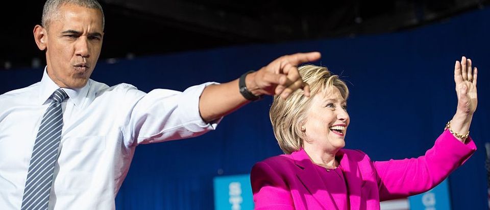 Barack Obama and Hillary Clinton arrive at a campaign event in Charlotte, North Carolina (Getty Images)
