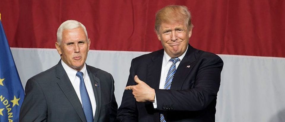 Donald Trump (R) and Indiana Governor Mike Pence (L) take the stage during a campaign rally at Grant Park Event Center in Westfield, Indiana. (Getty Images)