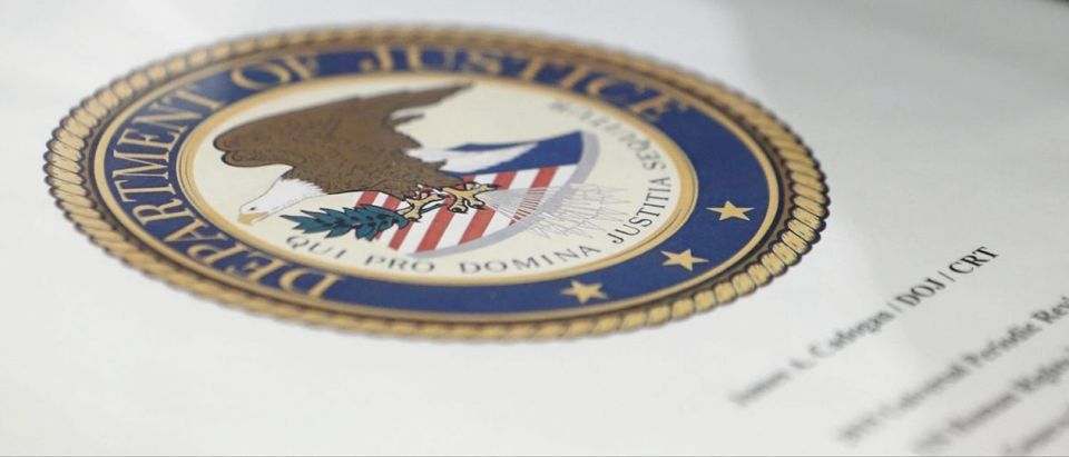 A folder with the seal of the Department of Justice, sits on a table prior to the start of the Universal Periodic Review of the U.S. at the United Nations European headquarters in Geneva, Switzerland, May 11, 2015