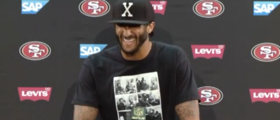 Colin Kaepernick, wearing a shirt commemorating the meeting between Malcolm X and Fidel Castro. [Fox 40 video screengrab/http://fox40.com/2016/08/27/fans-react-to-colin-kaepernicks-pregame-national-anthem-protest/]