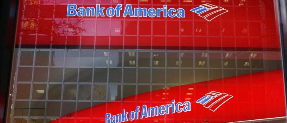 Reflections are seen in the windows of a Bank of America branch in New York