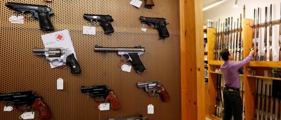 Handguns and sporting guns are displayed at Wyss Waffen gun shop in Burgdorf