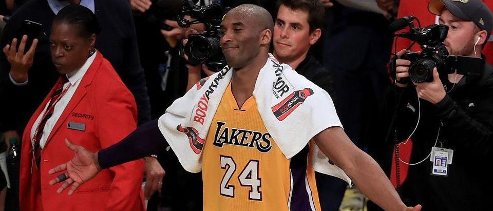 Kobe Bryant of the Los Angeles Lakers celebrates after scoring 60 points in his final NBA game at Staples Center on April 13, 2016 in Los Angeles