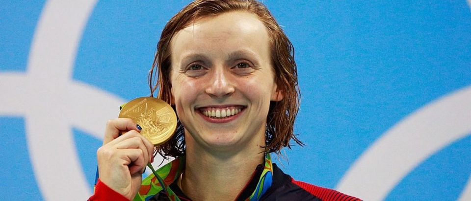 Gold medalist Katie Ledecky of the United States poses on the podium during the medal ceremony for the Women's 200m Freestyle Final on Day 4 of the Rio 2016 Olympic Games at the Olympic Aquatics Stadium on August 9, 2016 in Rio de Janeiro, Brazil