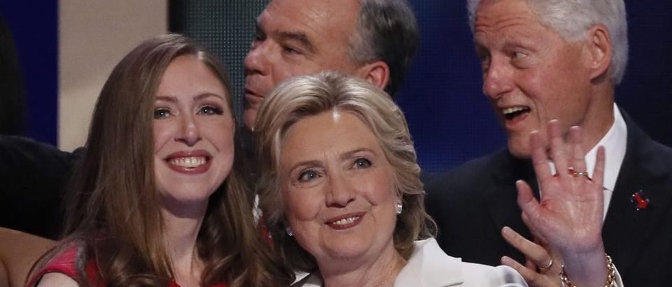 Democratic presidential nominee Hillary Clinton stands with her daughter Chelsea (L), vice presidential running mate Senator Tim Kaine (C, rear) and her husband former President Bill Clinton after accepting the nomination on the final day of the Democratic National Convention in Philadelphia, Pennsylvania, U.S. July 28, 2016. REUTERS/Mike Segar