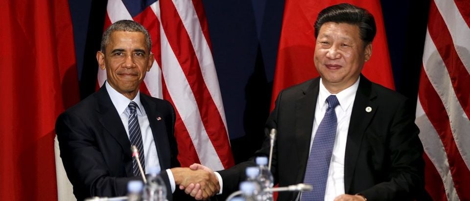 U.S. President Barack Obama shakes hands with Chinese President Xi Jinping during their meeting at the start of the climate summit in Paris