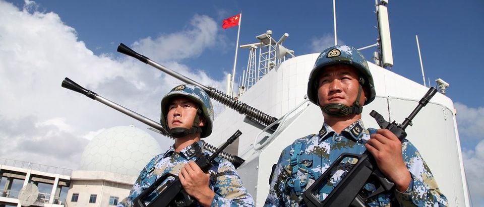 Soldiers of China's People's Liberation Army (PLA) Navy stand guard in the Spratly Islands, known in China as the Nansha Islands