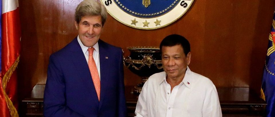 Philippine President Rodrigo Duterte welcomes U.S. Secretary of State John Kerry during his visit at the Malacanang presidential palace in metro Manila