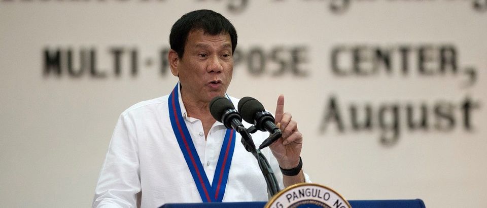 Philippine President Rodrigo Duterte gestures while delivering a speech during the 115th Police Service Anniversary at the Philippine National Police (PNP) headquarters in Quezon city, metro Manila