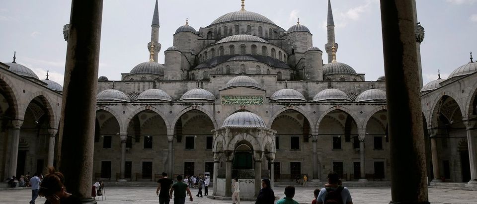 Tourists visit the Ottoman-era Sultanahmet mosque, also known as the Blue Mosque, in Istanbul