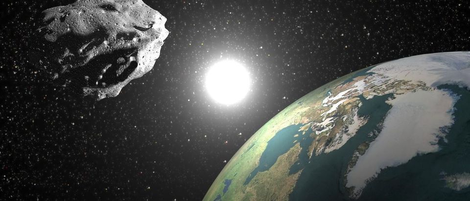 Asteroid nears Earth with sun in the background. Elements of this image furnished by NASA (Shutterstock/Elenarts)