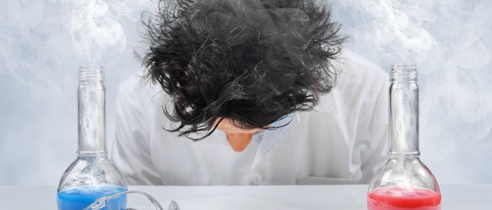 Tired crazy scientist in laboratory(Shutterstock/Poprotskiy Alexey)