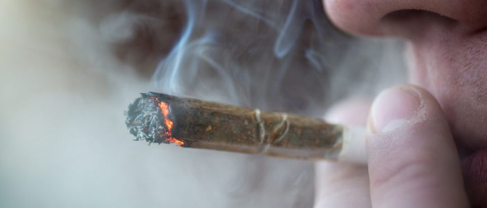 A marijuana user smoking a joint. Copyright: Pe3k/Shutterstock.com