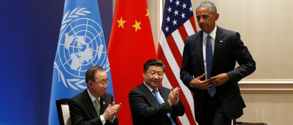 United Nations Secretary General Ban Ki Moon and China's President Xi Jinping applaud U.S. President Barack Obama as they participate in a climate event ahead of the G20 Summit, at West Lake State Guest Housee in Hangzhou