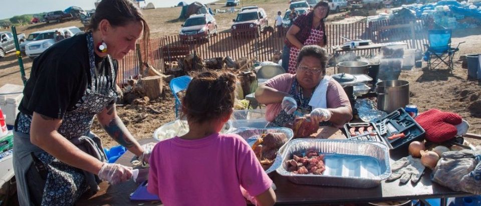 Volunteers prepare a traditional buffalo soup for protesters trying to halt construction of the Energy Transfer Partners Dakota Access oil pipeline near the Standing Rock Sioux reservation in Cannon Ball, North Dakota
