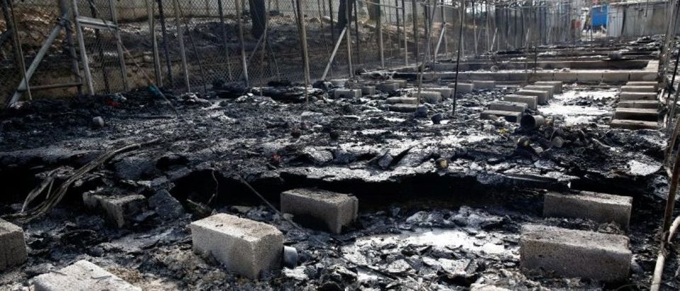 The remains of a burned tent at the Moria migrant camp, after a fire that ripped through tents and destroyed containers during violence among residents, on the island of Lesbos