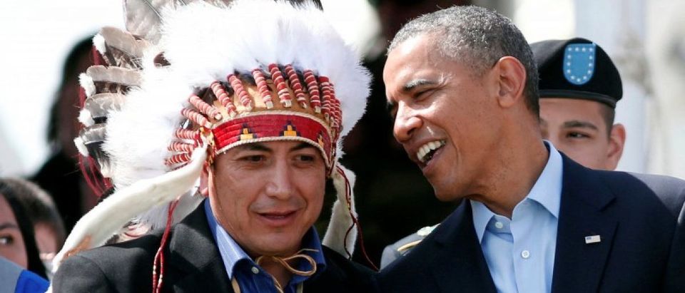 U.S. President Barack Obama talks to the Standing Rock Sioux Tribe Chairman David Archambault II (L) as they attend the Cannon Ball Flag Day Celebration at the Cannon Ball Powwow Grounds on the Standing Rock Sioux Reservation in North Dakota, June 13, 2014. REUTERS/Larry Downing/File Photo