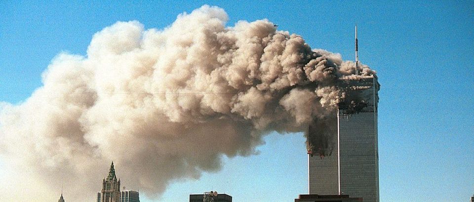 Smoke pours from the twin towers of the World Trade Center after they were hit by two hijacked airliners in a terrorist attack September 11, 2001 in New York City. (Photo by Robert Giroux/Getty Images)