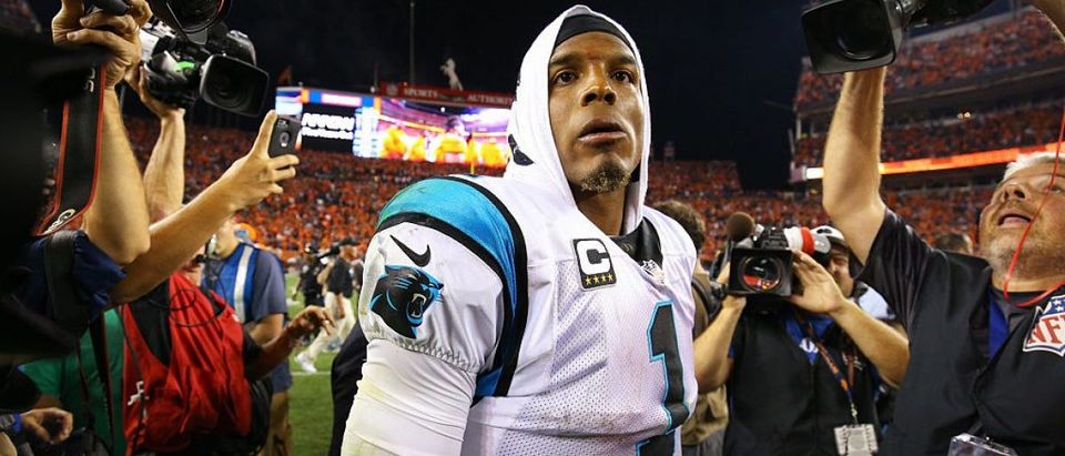 Quarterback Cam Newton #1 of the Carolina Panthers walks off the field after losing to the Broncos 21-20 at Sports Authority Field at Mile High on September 8, 2016 in Denver, Colorado