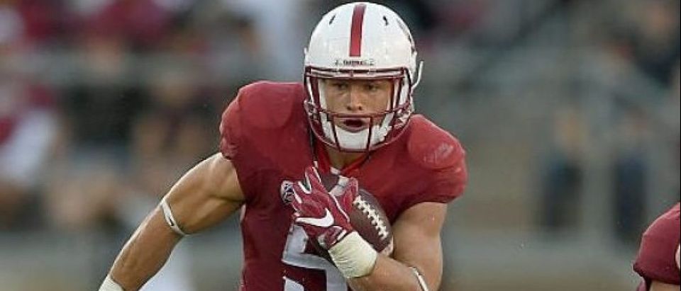 Christian McCaffrey #5 of the Stanford Cardinal carries the ball against the USC Trojans during the first half of their NCAA football game at Stanford Stadium on September 17, 2016 in Palo Alto, California