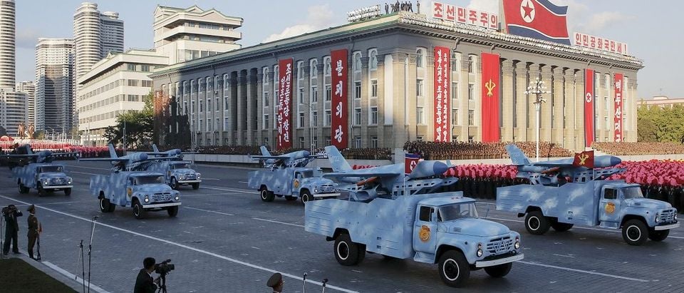 Trucks carry drones under a stand with North Korean leader Kim Jong Un and other officials during the parade celebrating the 70th anniversary of the founding of the ruling Workers' Party of Korea, in Pyongyang