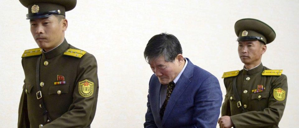 A man who identified himself as Kim Dong Chul, previously said he was a naturalised American citizen and was arrested in North Korea in October, leaves after a news conference in Pyongyang, North Korea