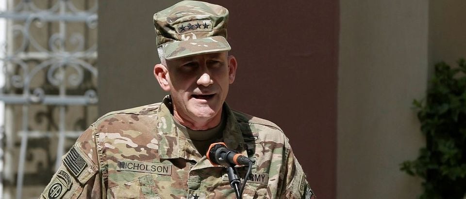 Nicholson speaks during a memorial ceremony to commemorate the 15th anniversary of the 9/11 attacks, in Kabul