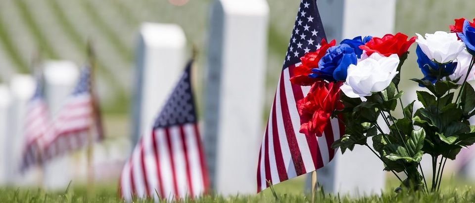 Cemetery memorial with American flag. (Action Sports Photography/Shutterstock.)