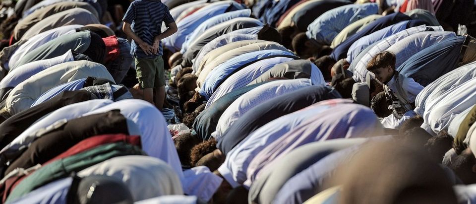 People participate in a group prayer session for the Muslim holiday Eid al-Adha in the Brooklyn borough of New York City